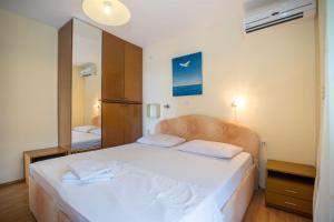 Postel nebo postele na pokoji v ubytování Apartments Rose
