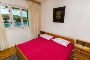 Postel nebo postele na pokoji v ubytování Apartments Franka