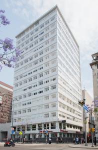 a large white building on a city street at Boutique Apartment Downtown 1506 in Mexico City