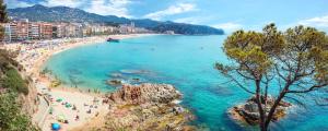 a view of a beach with people in the water at htop Amatista #htopBliss in Lloret de Mar
