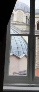 a view of a building through a window at Le Cupole di Trieste in Trieste