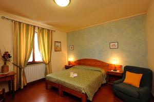 Postel nebo postele na pokoji v ubytování Boschetto del Lago + 37 fotografií