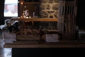 a table with a bunch of food on it at Hôtel La Grande Lanière in Les Gets