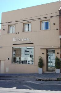 
a large building with a large window on the side of it at Horizonte Hotel in Mar del Plata
