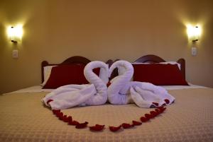 Giường trong phòng chung tại Kuska Hostal