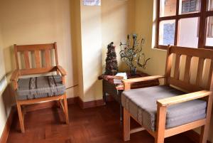 Khu vực ghế ngồi tại Kuska Hostal