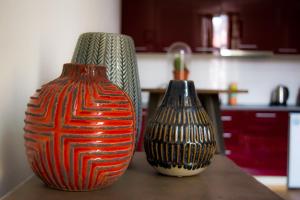 two vases sitting on a table in a kitchen at The Dutchies' apartment in Plovdiv
