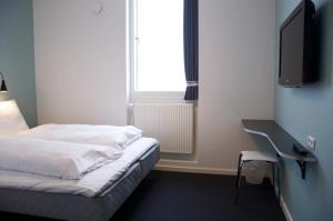 Postel nebo postele na pokoji v ubytování Motel X