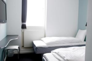 Postel nebo postele na pokoji v ubytování Motel X