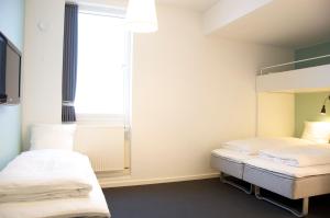 Postel nebo postele na pokoji v ubytování Motel X