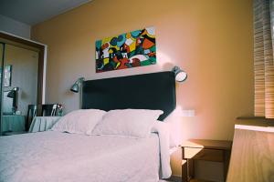 A bed or beds in a room at Hostal Goya II
