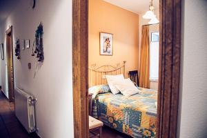 A bed or beds in a room at Hostal Goya II