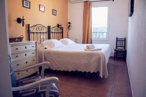 A bed or beds in a room at Hostal Goya II