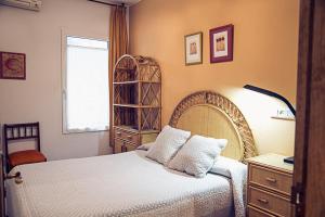 A bed or beds in a room at Hostal Goya II