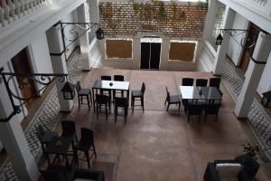 an overhead view of a dining room with tables and chairs at Casa Meba Hotel Boutique in Tampico