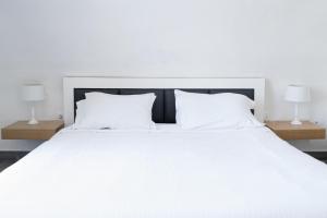 Voodi või voodid majutusasutuse Hotel Thireas toas