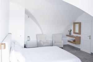 Voodi või voodid majutusasutuse Hotel Thireas toas