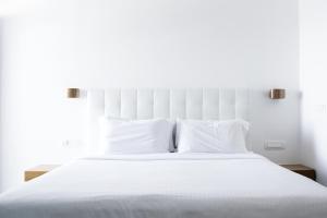 Voodi või voodid majutusasutuse Hotel Thireas toas