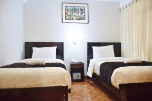 Postel nebo postele na pokoji v ubytování Machupicchu Guest House