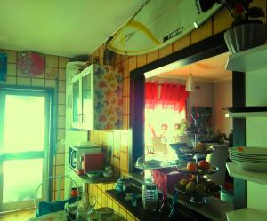 a kitchen with a sink and a window in it at Coffee Cream Guest House Maia in Maia