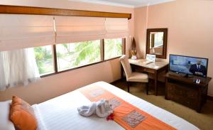 Voodi või voodid majutusasutuse The Jayakarta Yogyakarta Hotel & Spa toas