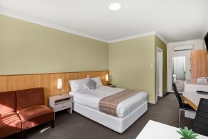 Ένα ή περισσότερα κρεβάτια σε δωμάτιο στο Adelaide Road Motor Lodge