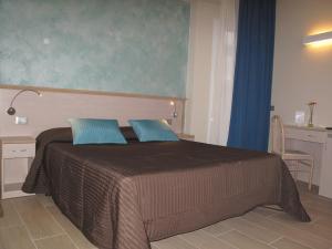 Postel nebo postele na pokoji v ubytování Hotel Olympic