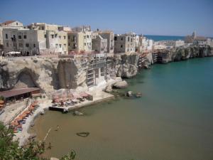 a view of a body of water with buildings at Residence Hotel Torresilvana in Vieste