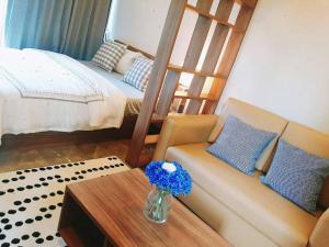 Un pat sau paturi într-o cameră la Rangsit Residence