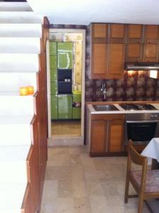 a kitchen with a sink and a stove top oven at Apartment Blaise-Old Town in Dubrovnik