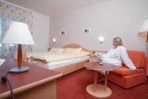 Letto o letti in una camera di Landhotel Reitingblick