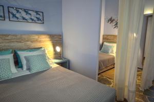 Postel nebo postele na pokoji v ubytování Hotel Peli