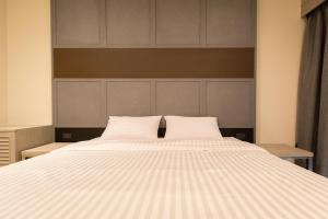 מיטה או מיטות בחדר ב-Lazy Sunday hostel
