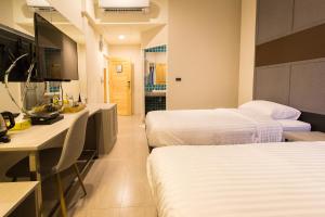 מיטה או מיטות בחדר ב-Lazy Sunday hostel