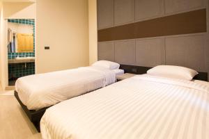 מיטה או מיטות בחדר ב-Lazy Sunday hostel