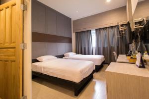 מיטה או מיטות בחדר ב-Lazy Sunday hostel