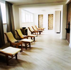 a row of chairs in a waiting room at Hotel Terme Marine Leopoldo II TERME & SPA in Marina di Grosseto