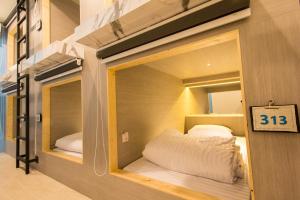מיטה או מיטות בחדר ב-Lazy Sunday hostel