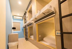 מיטה או מיטות בחדר ב-Lazy Sunday hostel