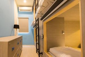 מיטה או מיטות בחדר ב-Lazy Sunday hostel
