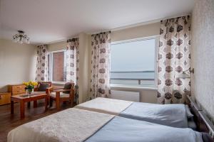 Postel nebo postele na pokoji v ubytování Hotel Mezaparks + 37 fotografií