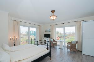 Ένα ή περισσότερα κρεβάτια σε δωμάτιο στο Hotel Villa Altes Land