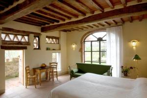 A bed or beds in a room at Locanda Casanuova