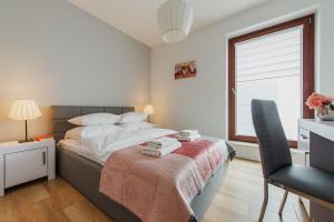 Posteľ alebo postele v izbe v ubytovaní P&O Serviced Apartments Solec + 23 fotografií
