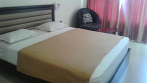 Postel nebo postele na pokoji v ubytování Rio Grande Residency