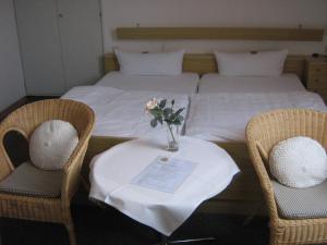 Ein Bett oder Betten in einem Zimmer der Unterkunft Berghotel Holzerath