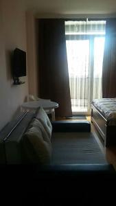 Llit o llits en una habitació de Orbi Residence