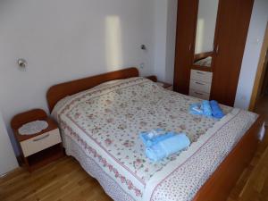 Postel nebo postele na pokoji v ubytování Vacation apartments Feniks