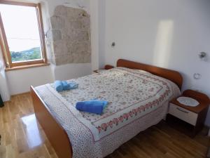 Postel nebo postele na pokoji v ubytování Vacation apartments Feniks