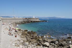 a group of people on a beach near the water at Vieille Ville 2 - La Petite Maison à Safranier, 2 bedrooms, max 4 adults and 2 kids in Antibes